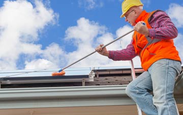 Hanging Langford soft wash roof cleaning